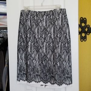 Black lace over white satin skirt